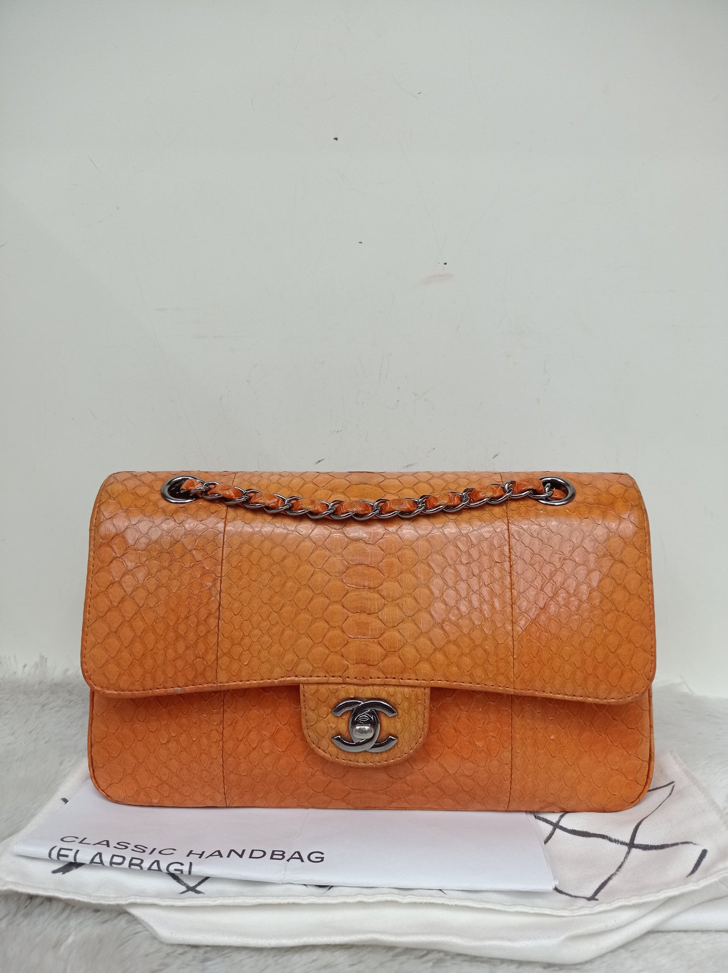 Chanel Medium Exotic Python Orange RHW DF #19
With holo, holo checker, dustbag